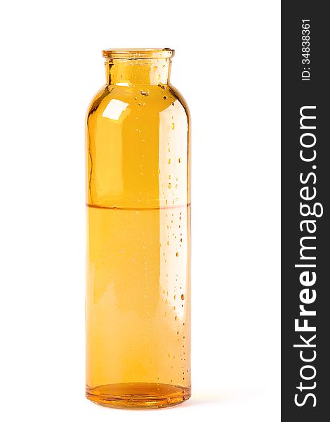 Yellow glass bottle on a white background