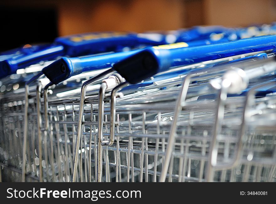 Row Of Metal Shopping Carts In A Supermarket