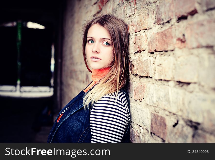 Portrait of attractive girl outdoor near old building