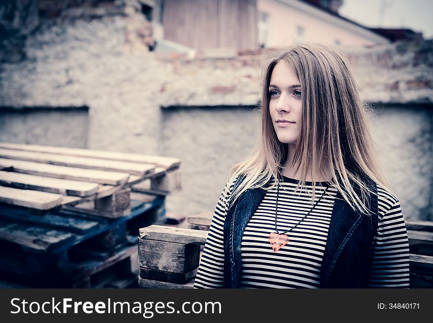 Portrait of attractive girl outdoor near old building