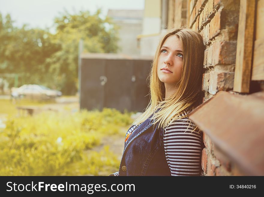 Attractive girl outdoor near old building