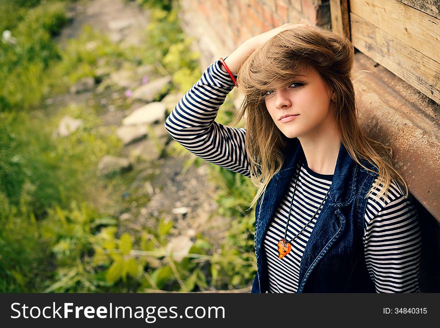 Portrait of attractive girl outdoor near old building