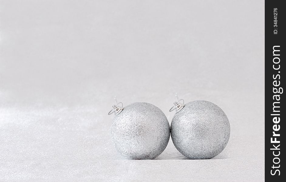 Silver balls for Christmas tree on gray background