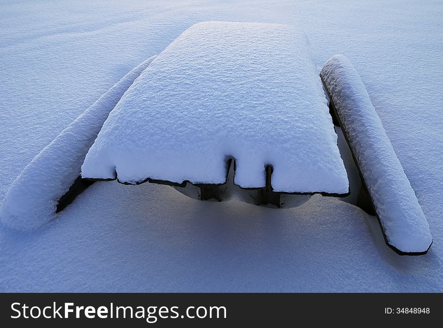 Snow-covered Table And Benches