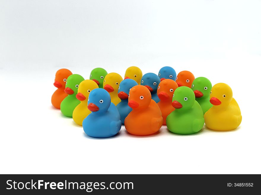 Colorful flock of ducklings isolated on white background