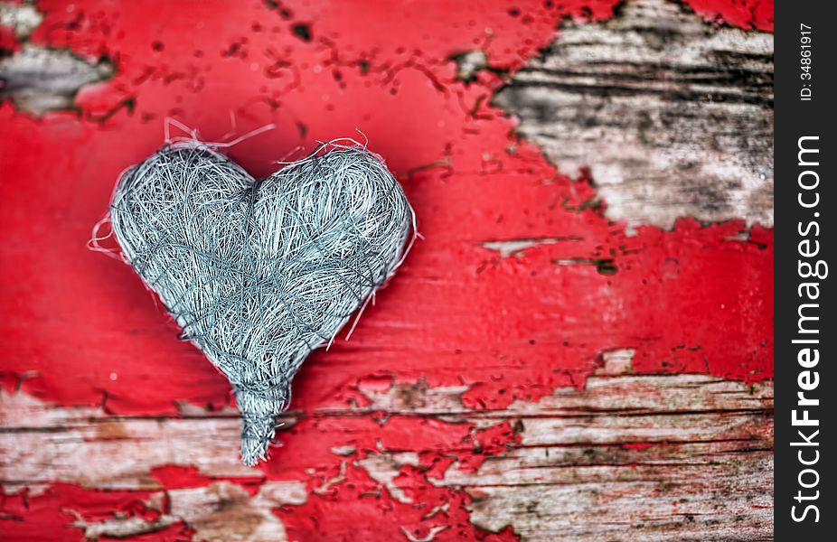 Grey heart on red wooden background. Grey heart on red wooden background