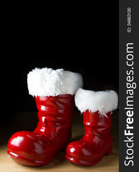 Red Santa boot on black background