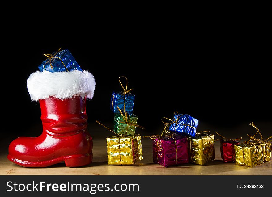 Red Santa boot on black background