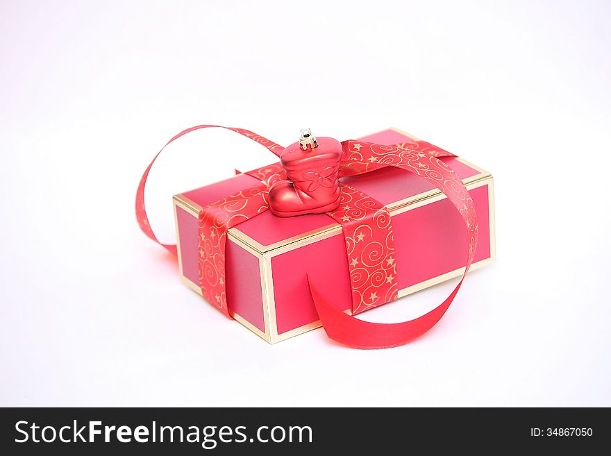 Red Christmas gift box on white background.