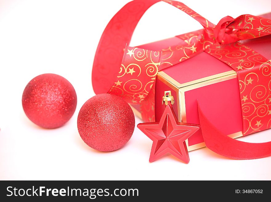 Red Christmas gift box, Cristmas star on white background.