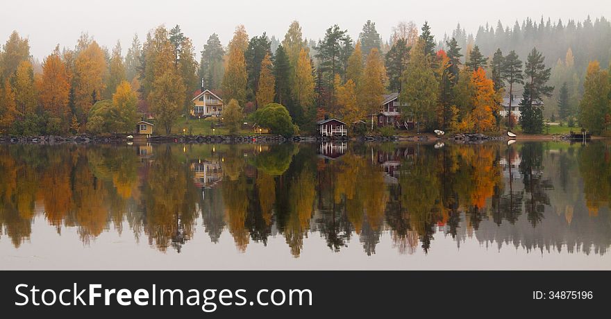Autumn lake with trees mirroring. Autumn lake with trees mirroring