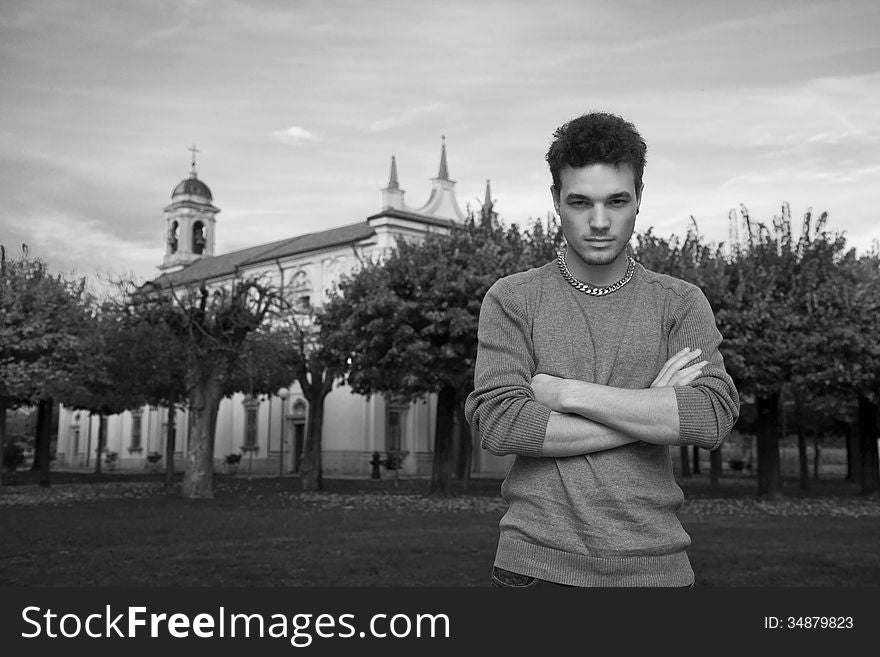 Rebel boy standing in front of a church. Rebel boy standing in front of a church