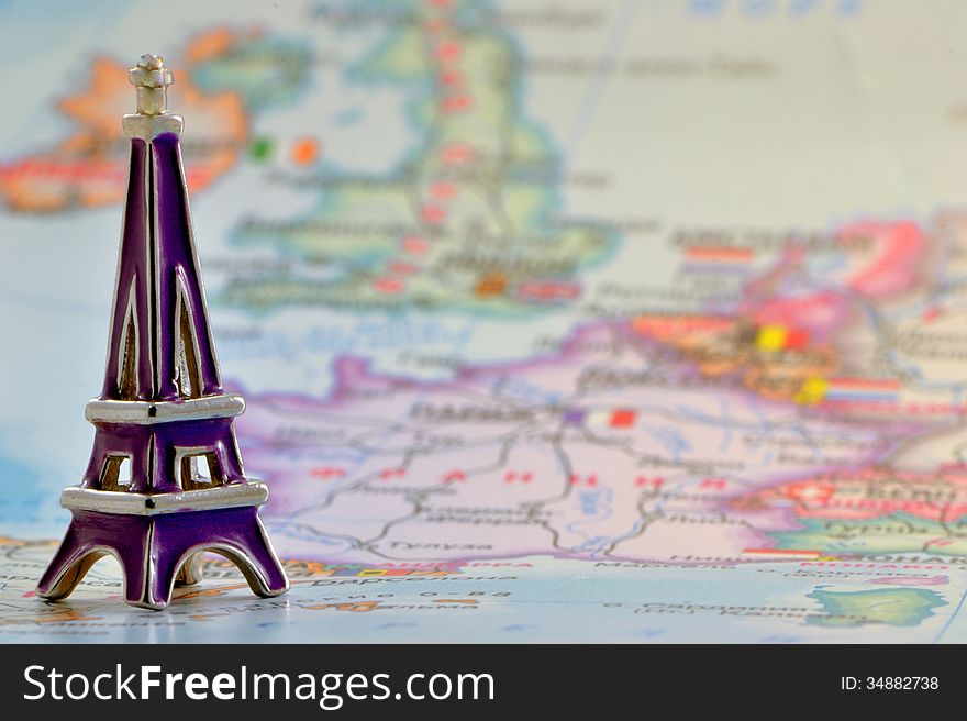 Model of the Eiffel Tower on a background map France