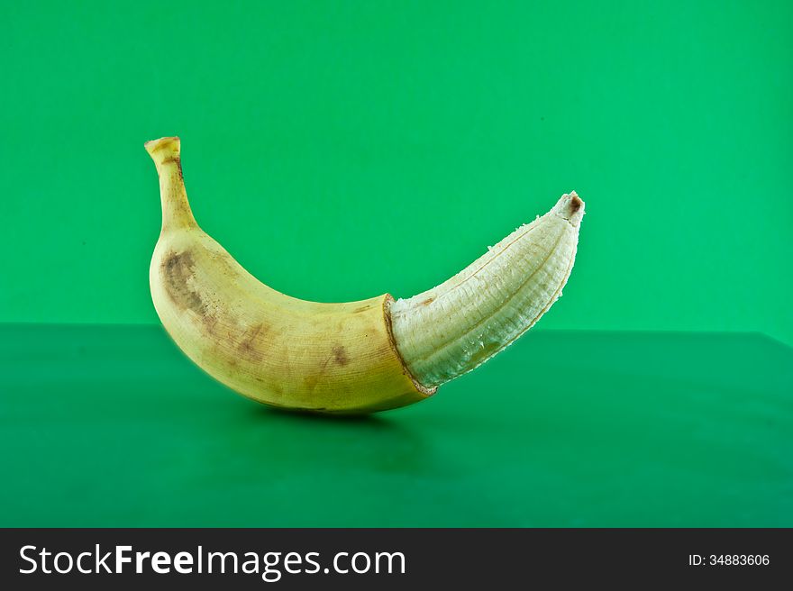 Banana against a green background