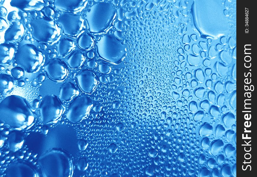 Condensate of water on a blue background. Condensate of water on a blue background