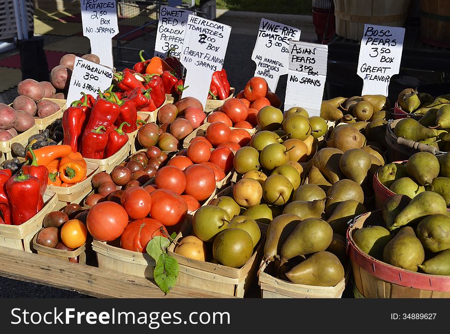 Fresh Produce on display and for sale at a local outdoor market in rural Michigan, USA. Fresh Produce on display and for sale at a local outdoor market in rural Michigan, USA