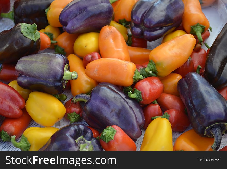 Colorful peppers for sale at a local outdoor food market in rural Michigan, USA