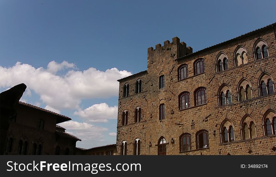 Europe. Italy. Pitigliano. View of the old building and the clouds that run quickly through the blue sky. Europe. Italy. Pitigliano. View of the old building and the clouds that run quickly through the blue sky