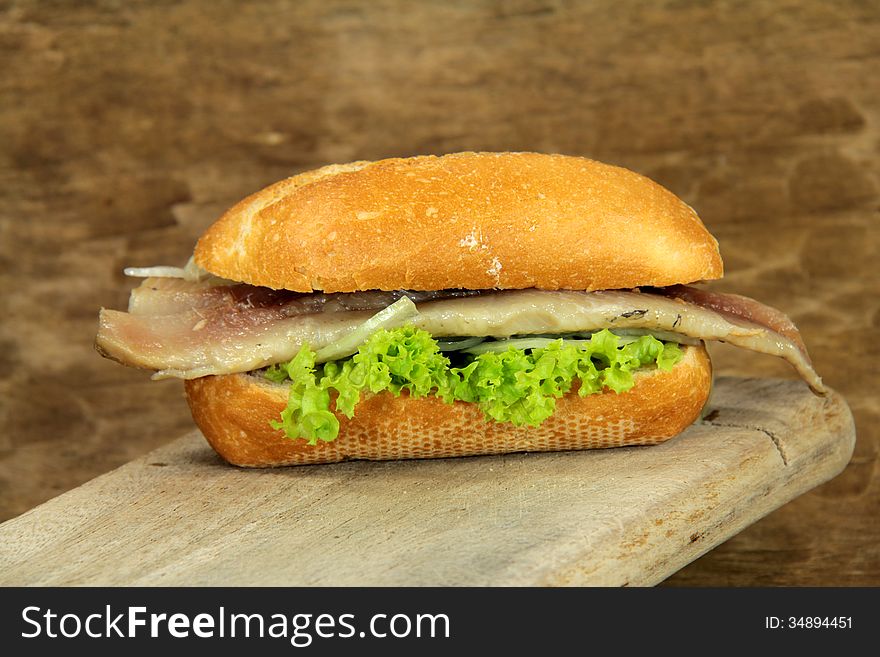 Herring bread rolls on brown background