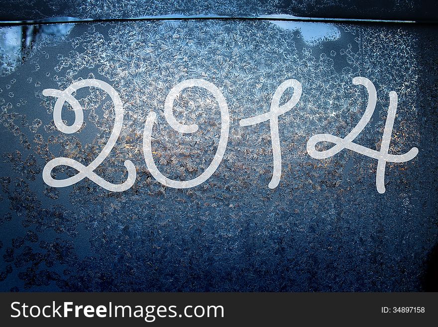 2014 on the frozen surface of the window. 2014 on the frozen surface of the window