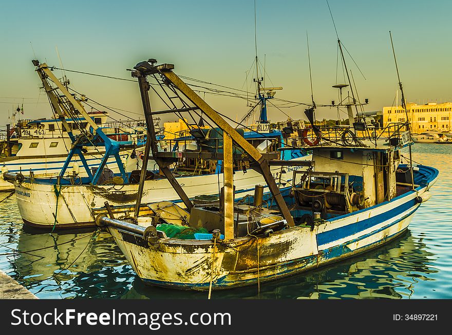 Fishing boats in the harbor of trani, puglia, italy