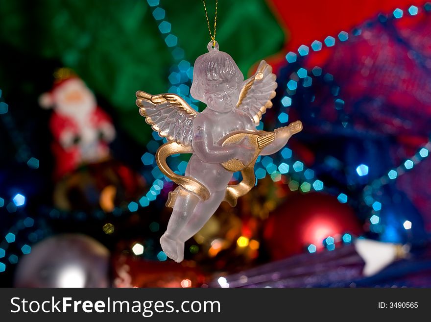 Angel with Christmas decoration and ornaments for a Christmas tree