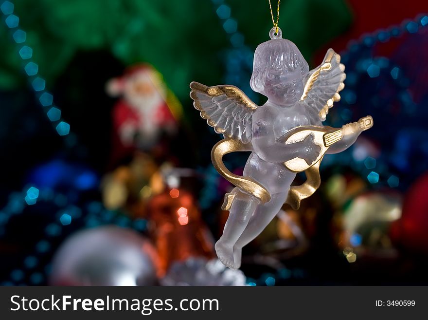 Angel with Christmas decoration and ornaments for a Christmas tree