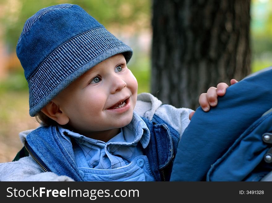 Little boy looking curiosly and smiling. Little boy looking curiosly and smiling