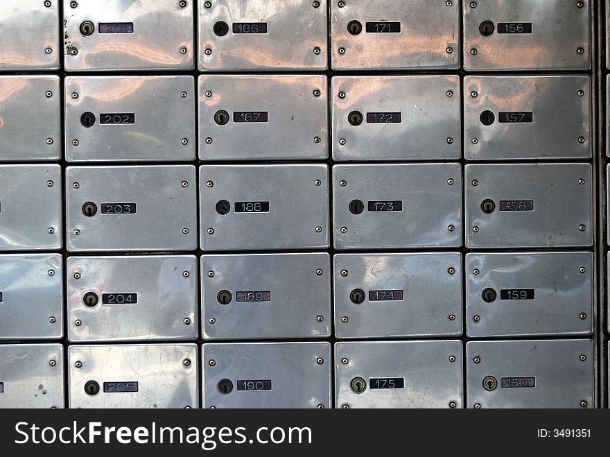 Close-up of letter-boxes in post office