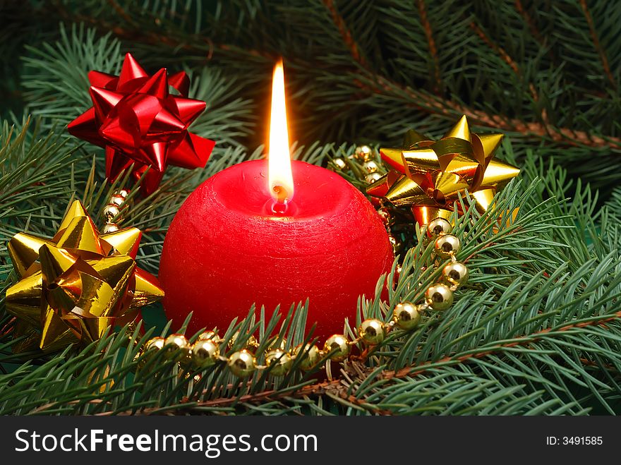 Red candle and christmas decorations. Red candle and christmas decorations