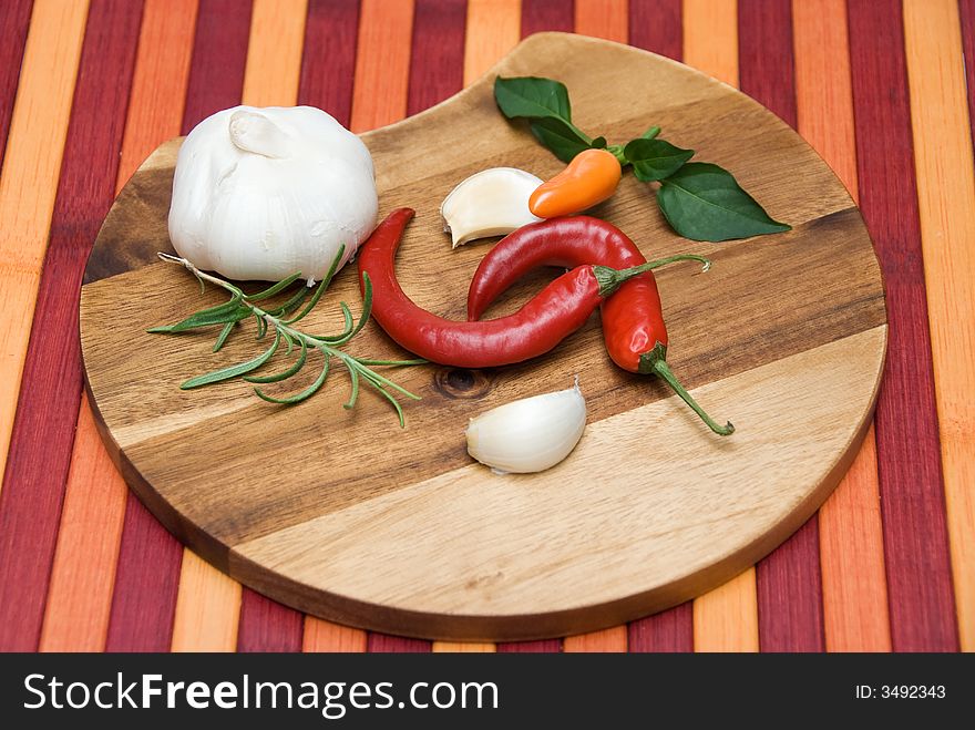 Various spices on a wooden plate. Various spices on a wooden plate