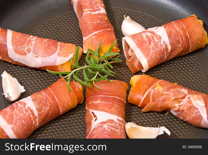 Chicken covered in ham with spices and herbs. Chicken covered in ham with spices and herbs