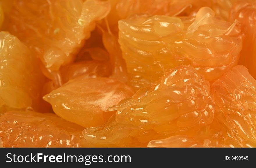 Close-up on chopped grapefruit. Food background