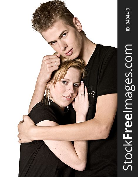 Couple of teenagers in the studio on a white background. Couple of teenagers in the studio on a white background