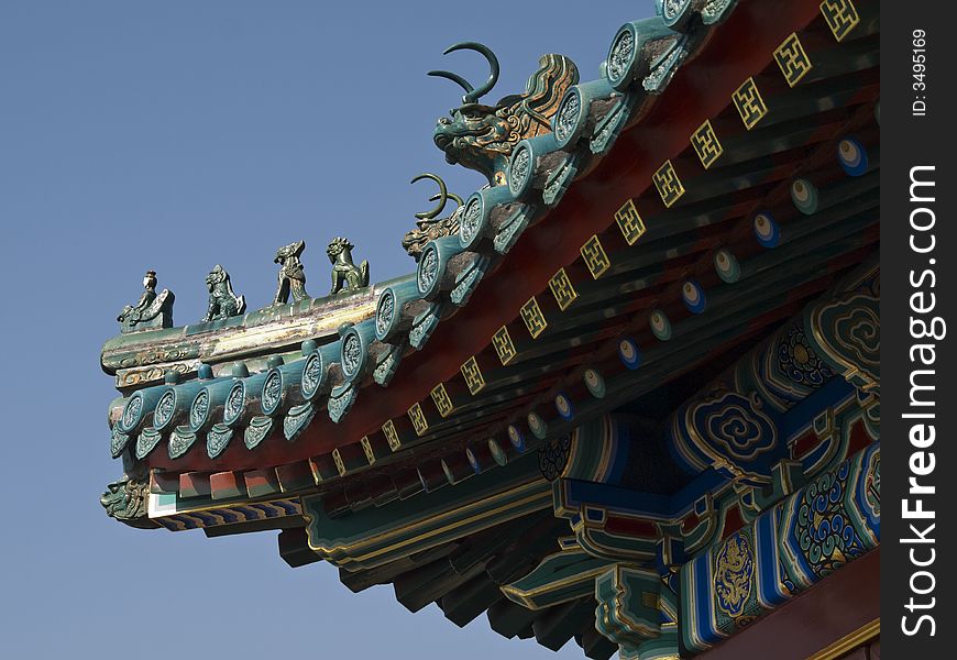 Edge of a chinese temple roof with little figures on it. Edge of a chinese temple roof with little figures on it