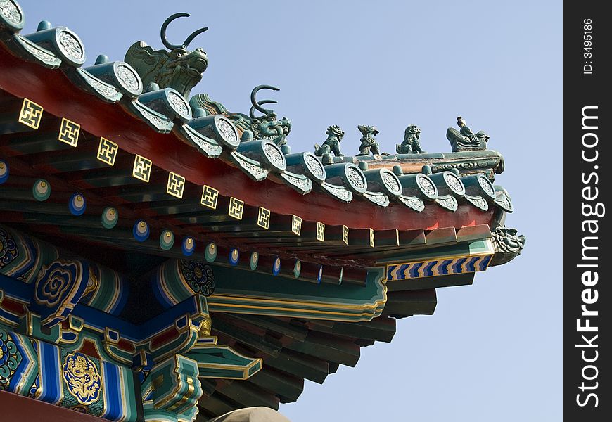 Edge of a chinese temple roof with little figures on it. Edge of a chinese temple roof with little figures on it