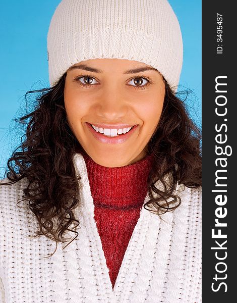 Winter girl in white isolated on blue background
