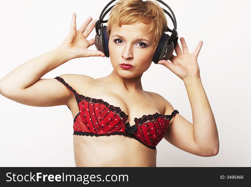 Close up portrait of young and attractive party girl with headphones