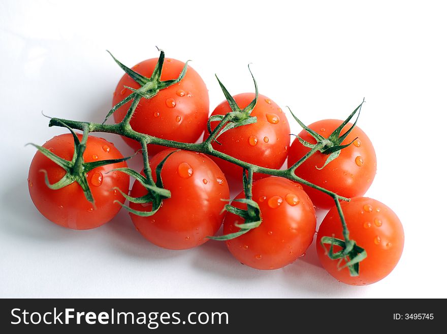 Bunch of tomatoes on a white background