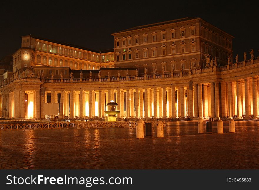 St. Peter's (Rome - Italy - Vatican City) House residence of the Pope at night / At the center is visible the building where the Pope sleep and preaches the Angelus on Sunday morning / St Peter's Square and Colonnade. St. Peter's (Rome - Italy - Vatican City) House residence of the Pope at night / At the center is visible the building where the Pope sleep and preaches the Angelus on Sunday morning / St Peter's Square and Colonnade