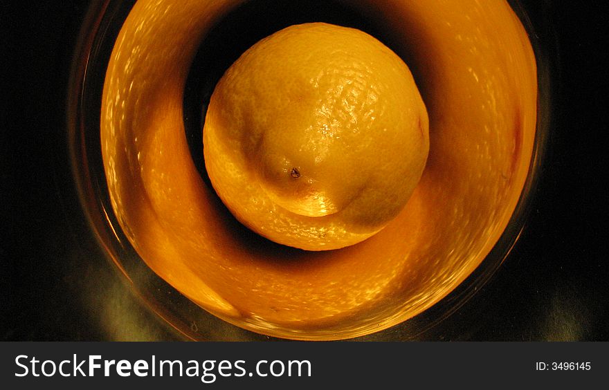 Lemon in trumpet in yellow light