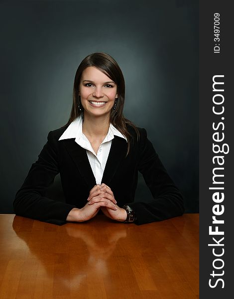 Portrait of a young businessman sitting comfortably.