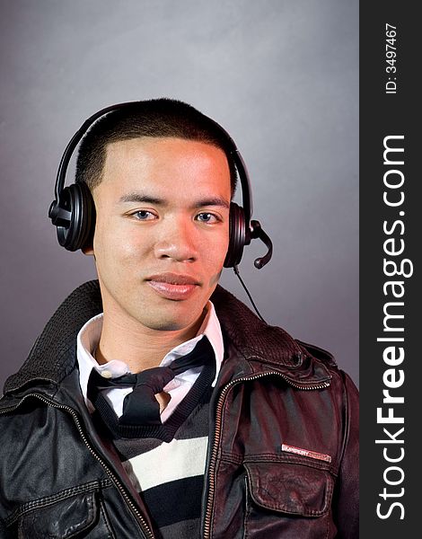 Man smilling with headset on his ear. Man smilling with headset on his ear.