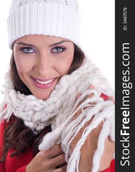 Winter portrait of a beautiful woman wearing woolen scarf and hat