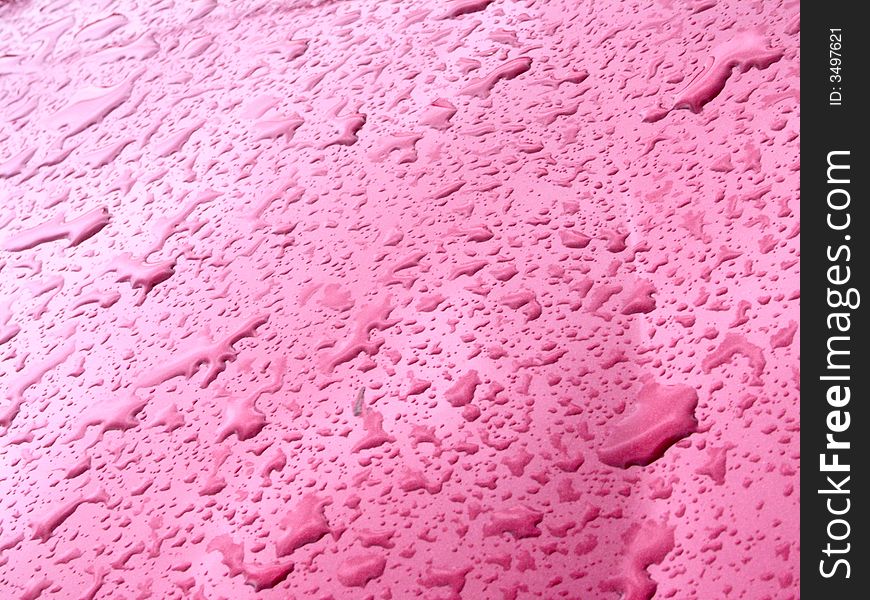 Water drops on pink metal. Water drops on pink metal