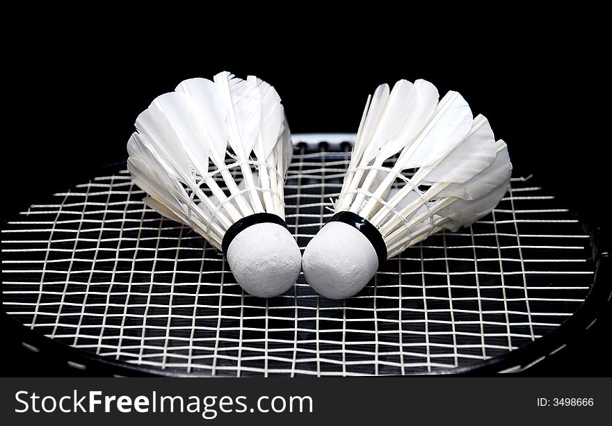 Focus a shuttlecocks image on the badminton racket