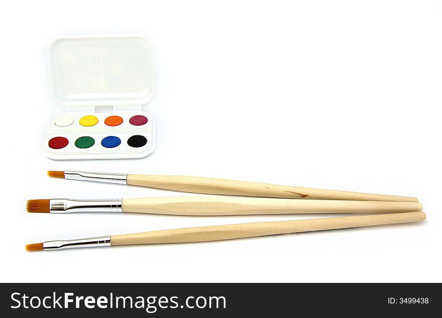 Paintbrushes of wood with water-colors of colors