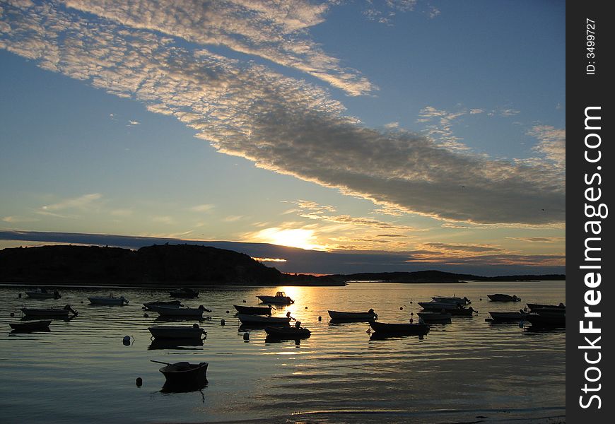 Small boats on a lake during sunset. Small boats on a lake during sunset