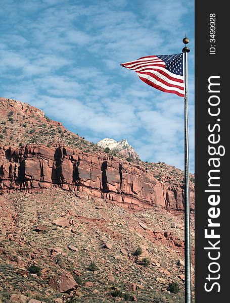 American flag waving in the breeze at the entrance to Zion National Park. American flag waving in the breeze at the entrance to Zion National Park