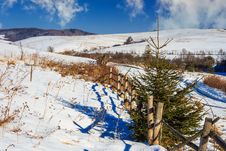 Fence By The Road To Snowy Forest In The Mountains Royalty Free Stock Images Fence By The Road To Snowy Forest In The Mountains Royalty Free Stock Images